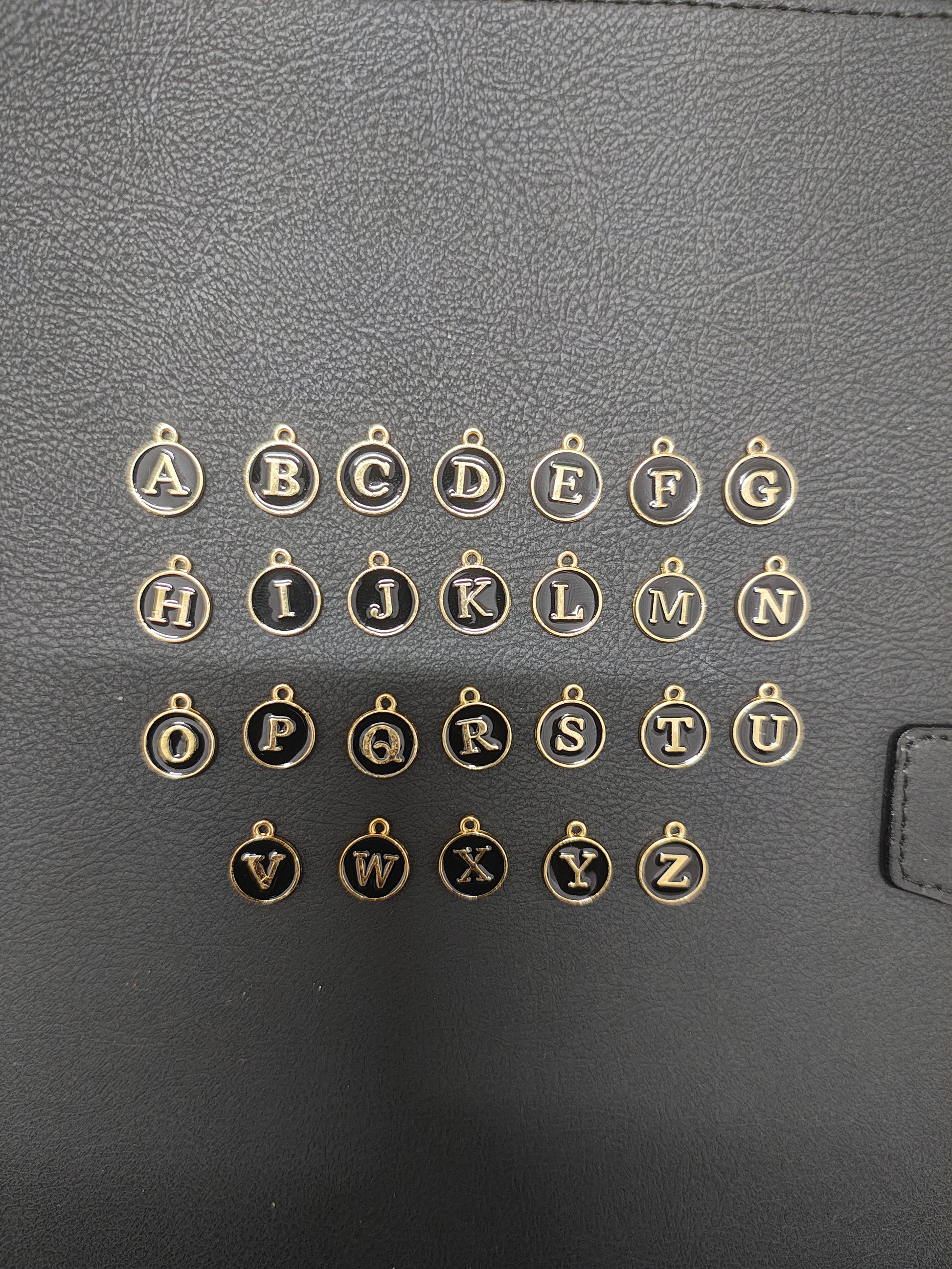 Round black alphabet charm ( atoz set) ( EC1096 )
