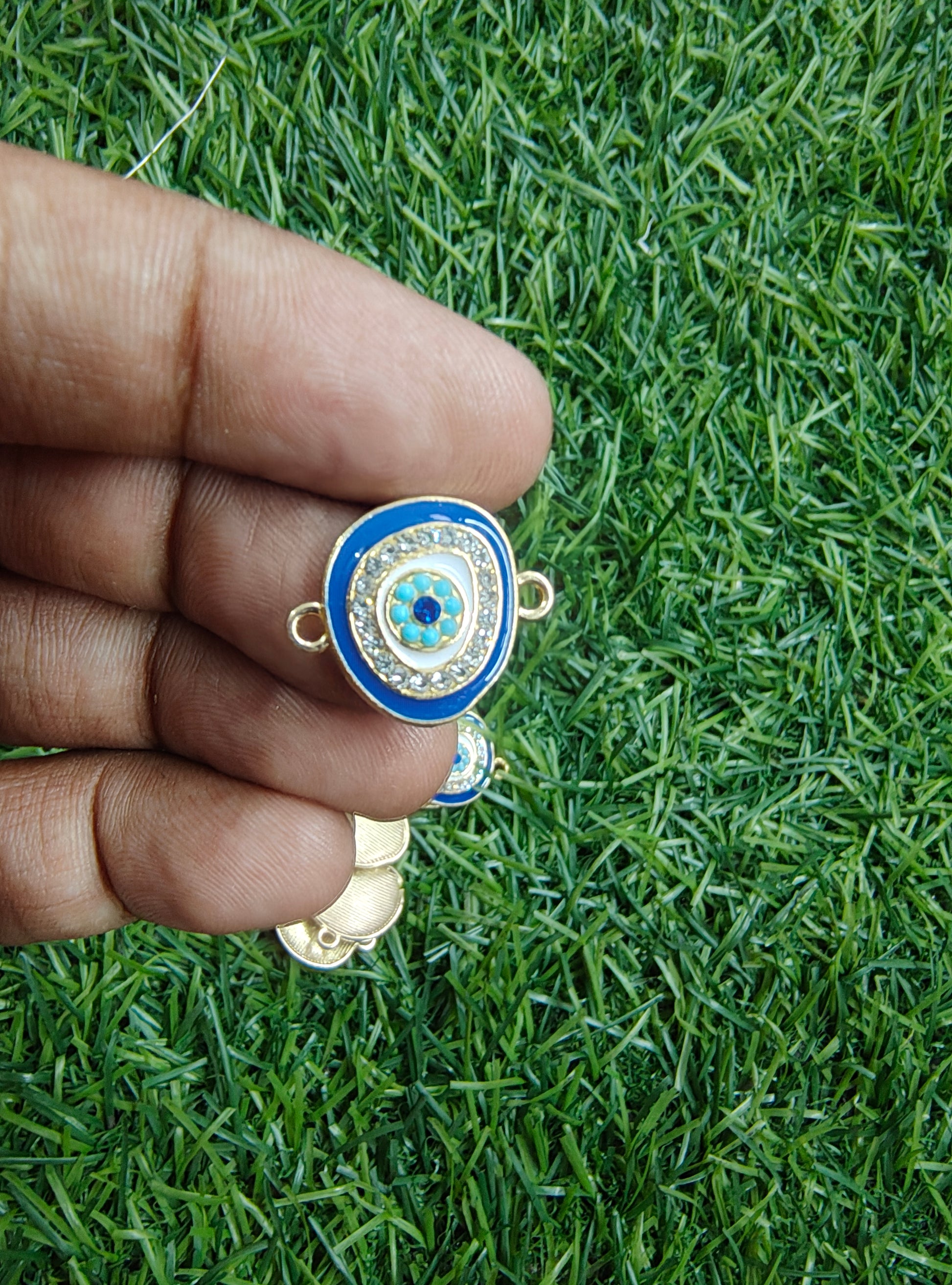 Stone evil eye rakhi charm