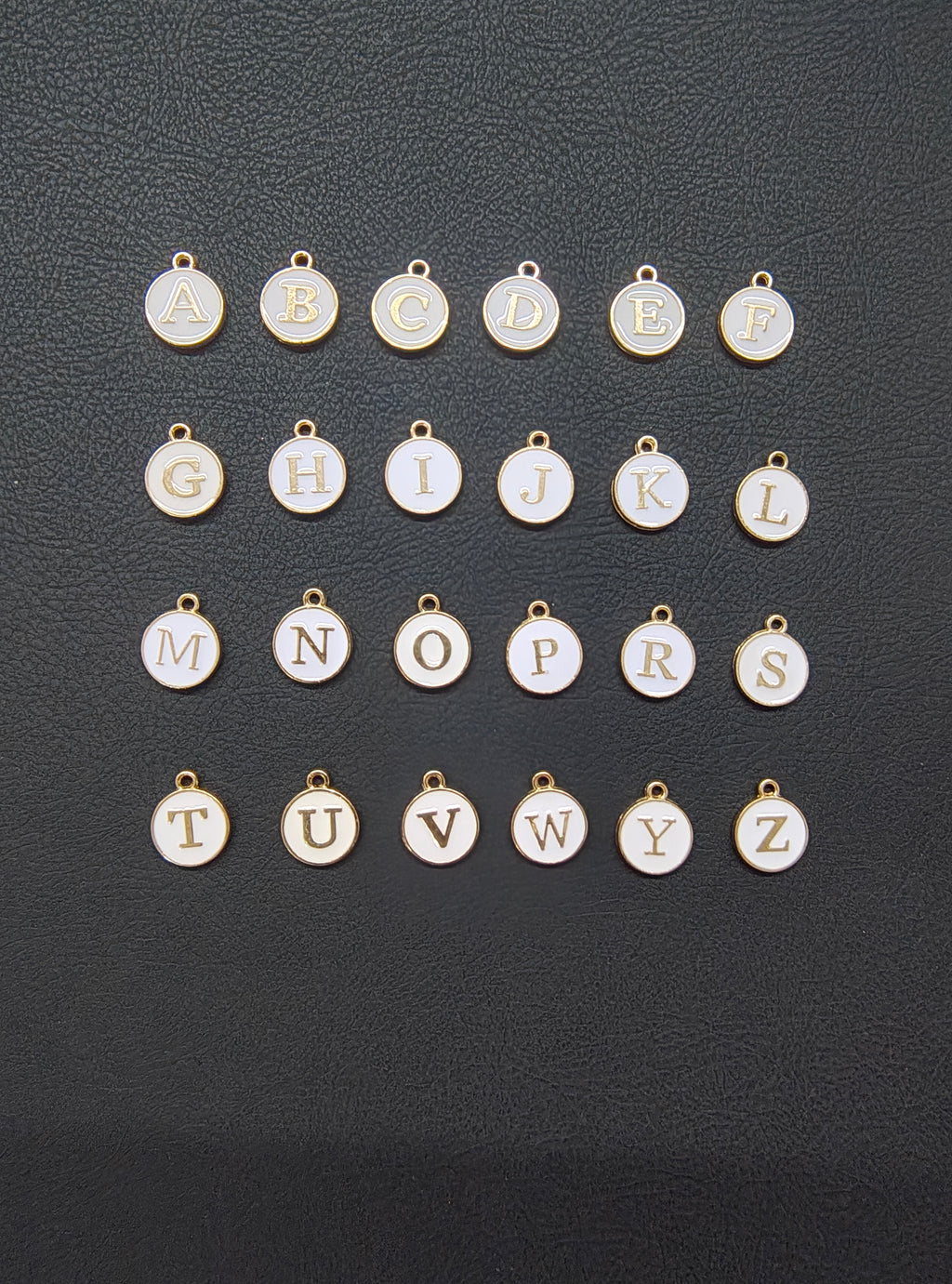 Round white alphabet charm