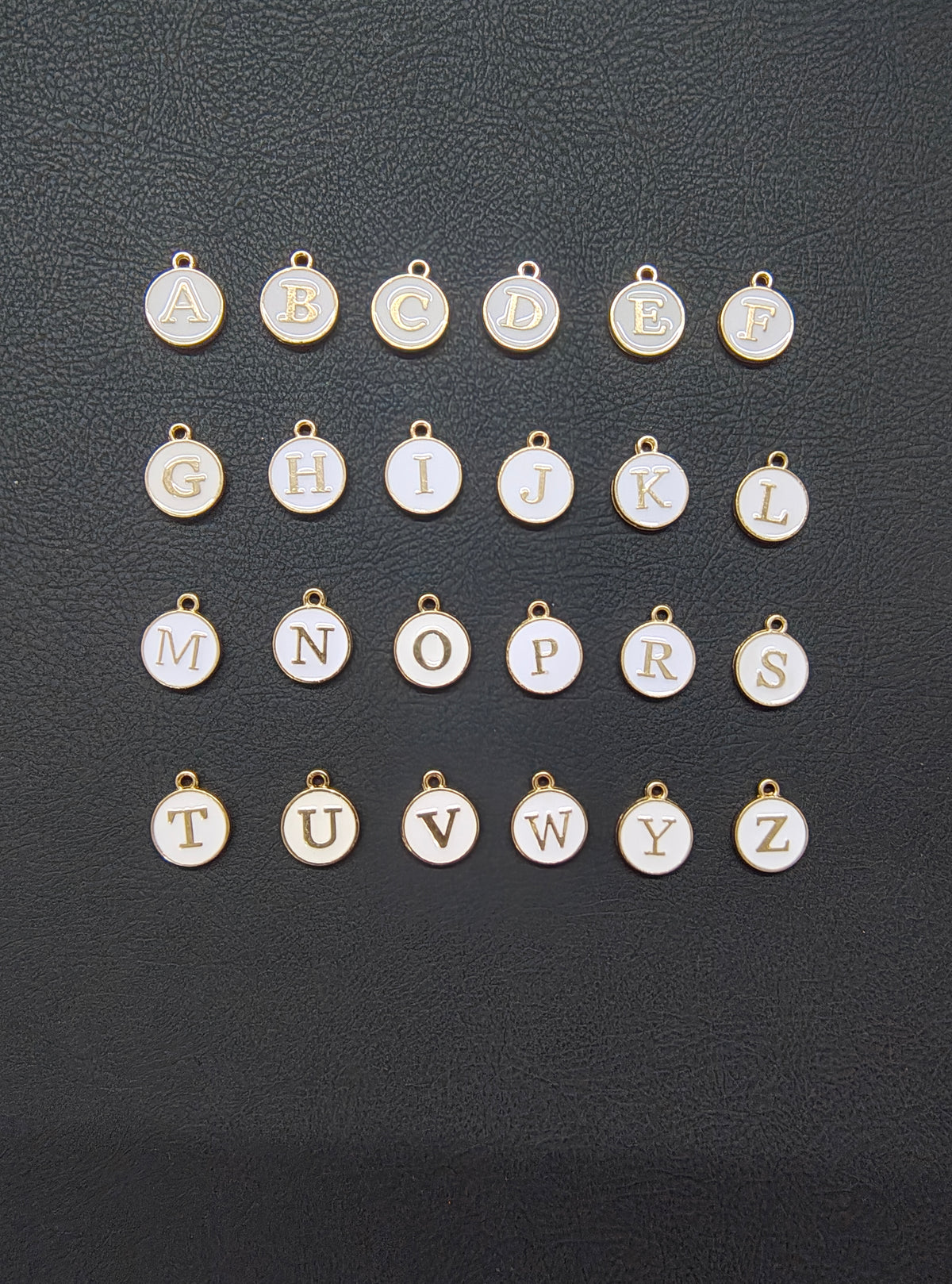 Round white alphabet charm