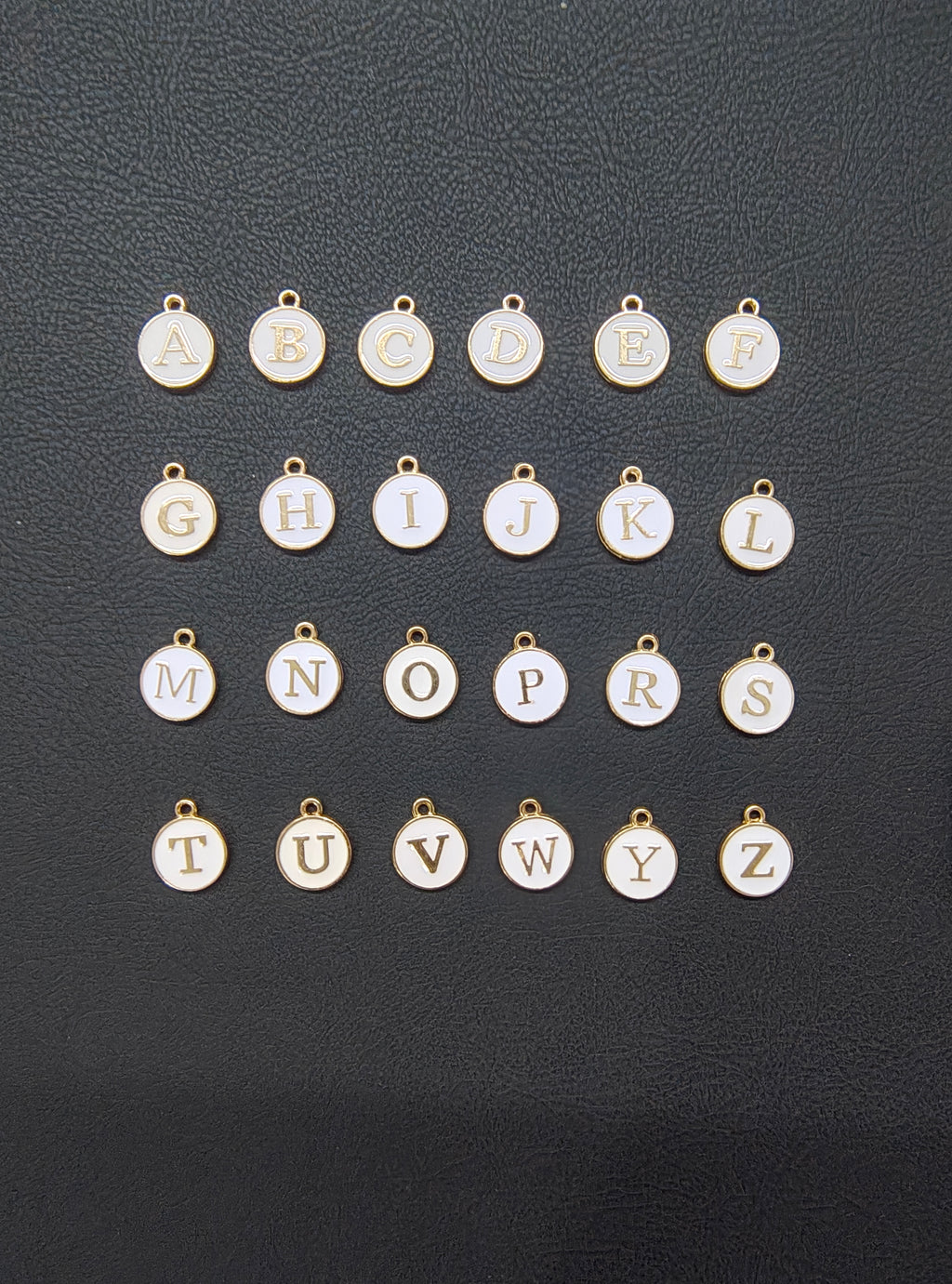 Round white alphabet charm